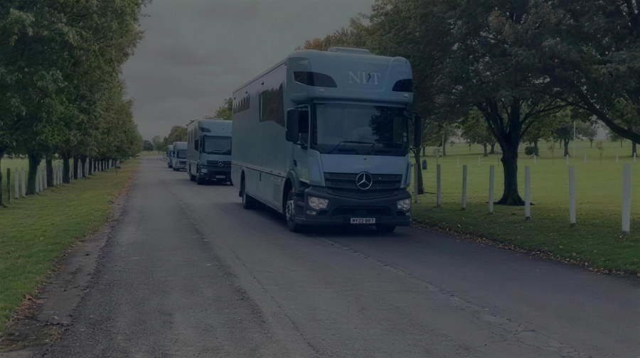 Two NRT horseboxes on a tree-lined avenue